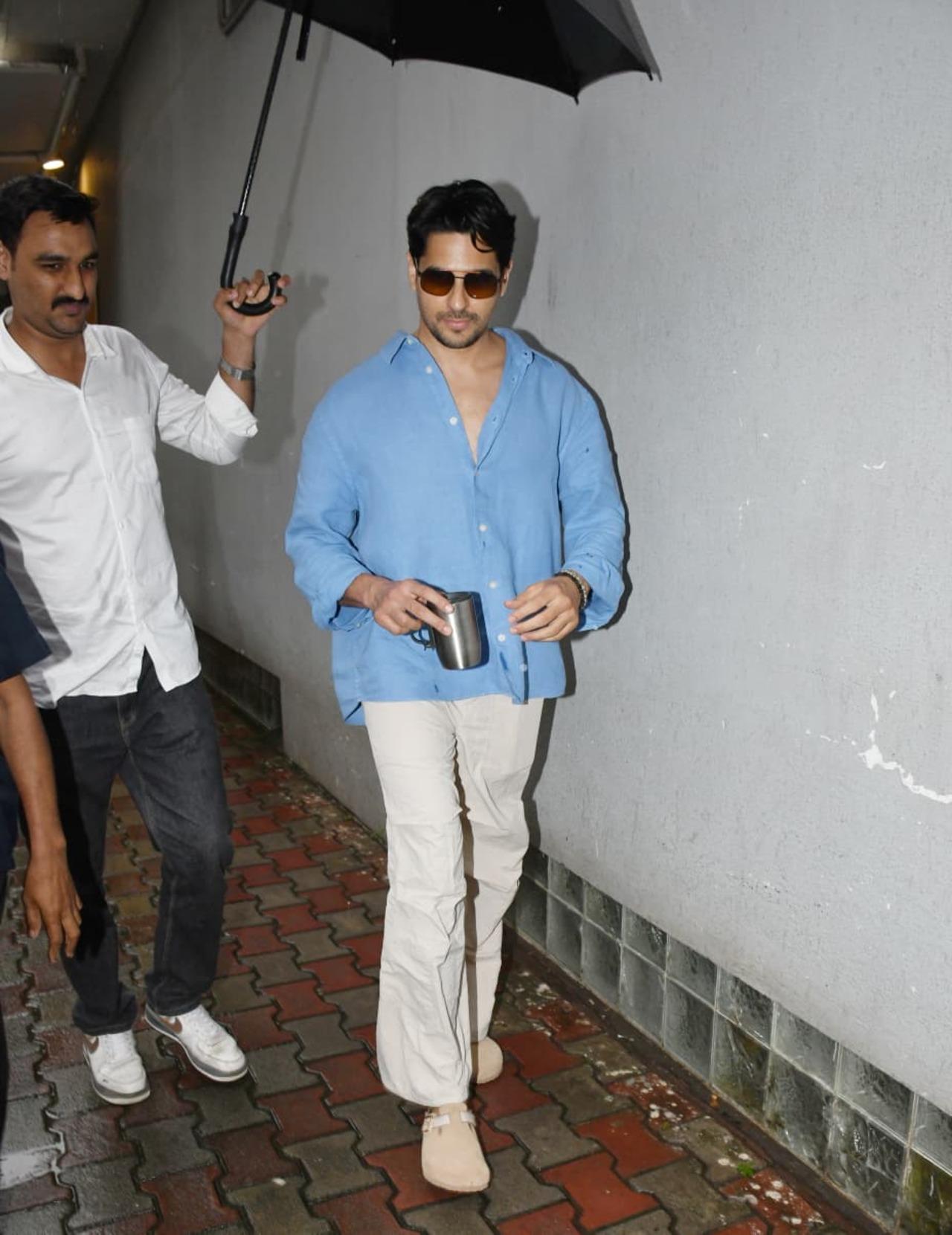 Sidharth Malhotra was spotted in a relaxed blue shirt paired with white trousers, striking the perfect balance between comfort and style.